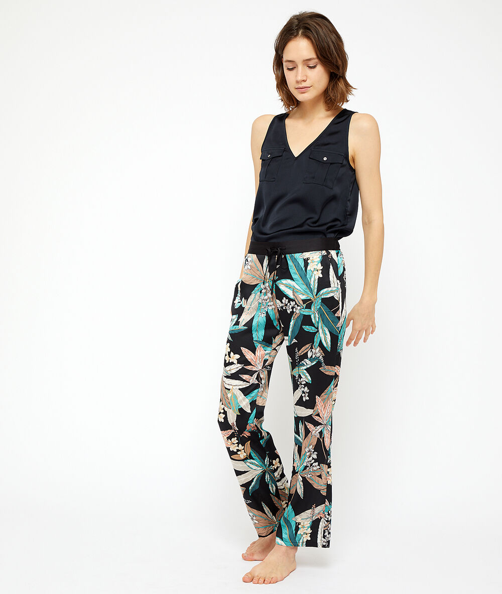 Pantalon imprimé feuillage noir.