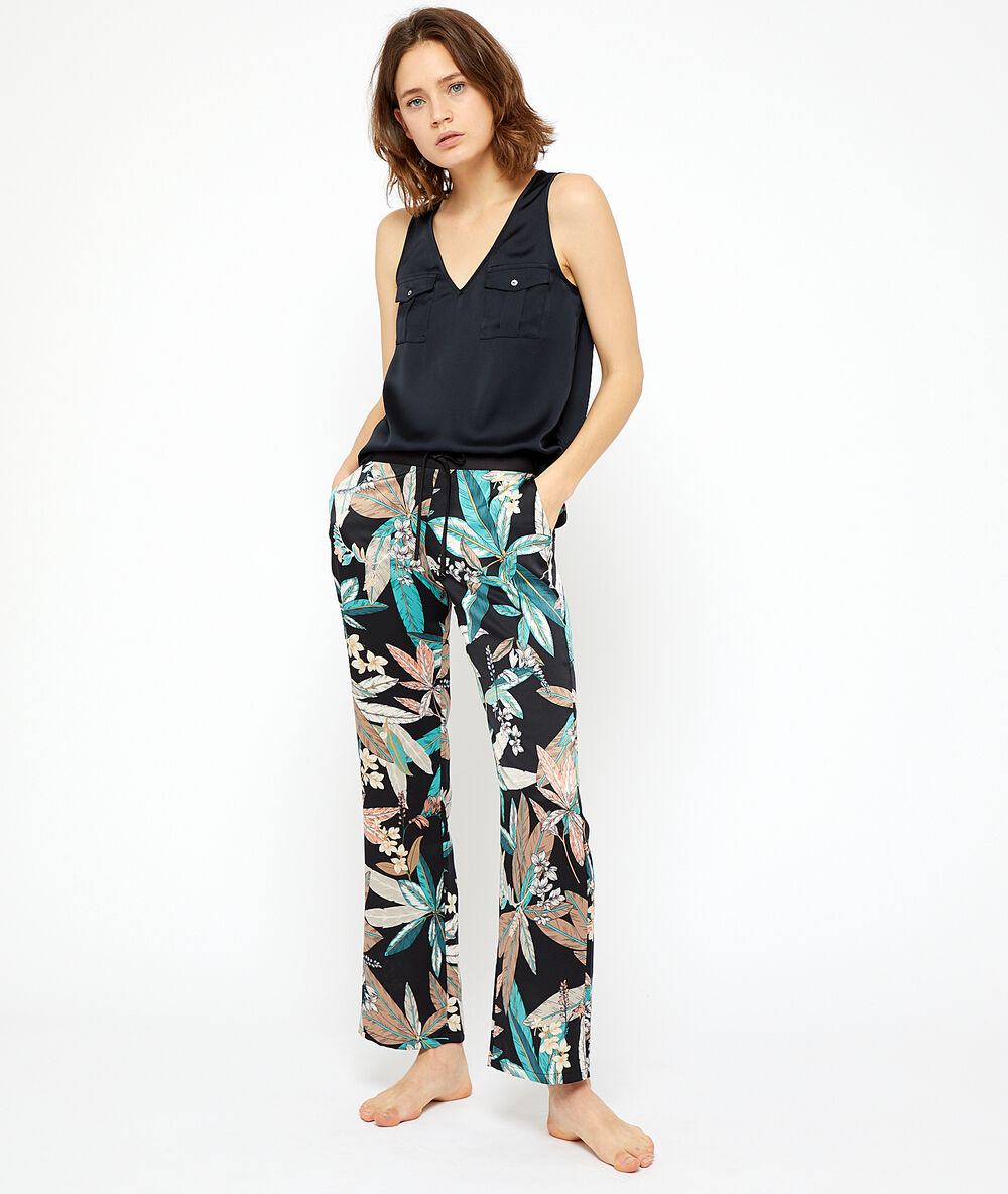 Pantalon imprimé feuillage noir.