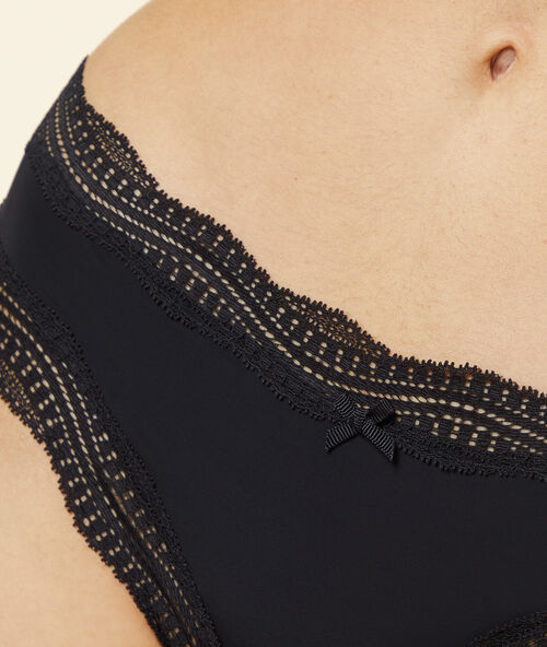 Tanga bords dentelle graphique noir.