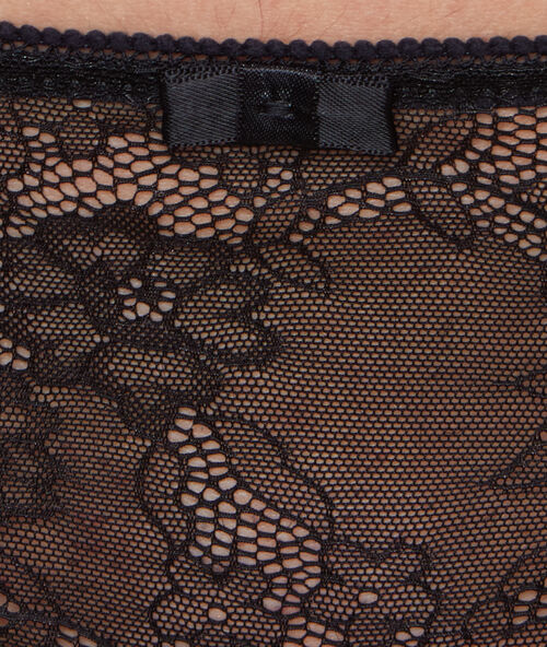 Tanga bi-matière noir.