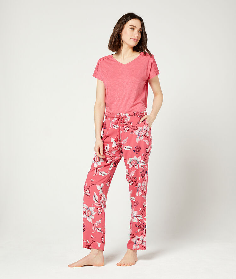Pantalon imprimé fleuri corail.
