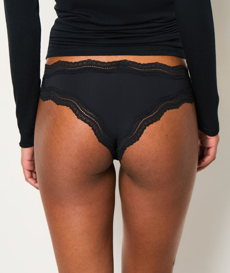 Tanga bords dentelle graphique noir.