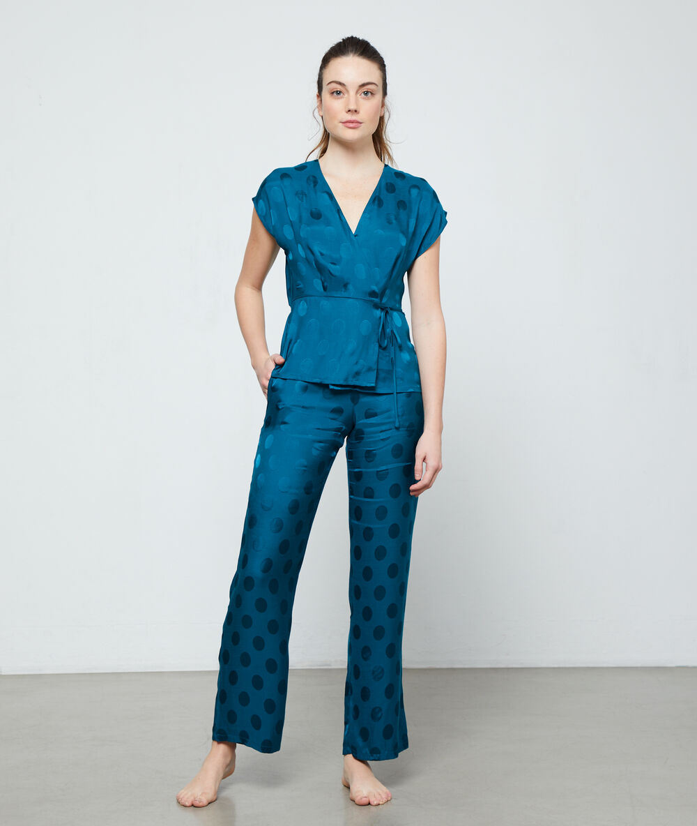 Pantalon à pois vert.