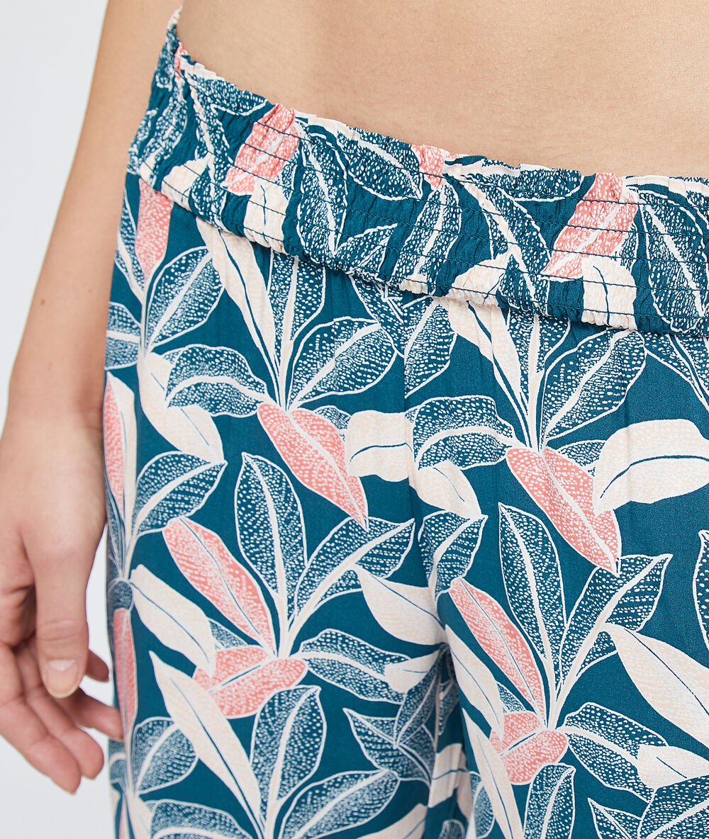 Pantalon imprimé feuillage multicolore.