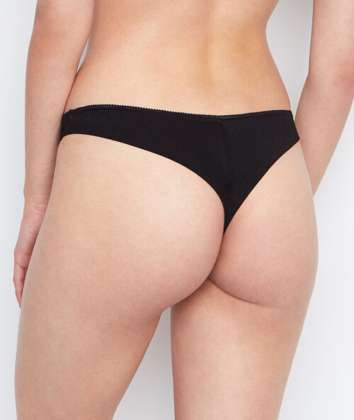 Tanga bi-matière noir.